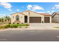 Charming single-story home featuring a stucco exterior, tile roof, and a well-manicured front yard at 9612 E Rainbow Ave, Mesa, AZ 85212