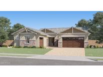 Inviting single-story home featuring a stone-accented facade, two-car garage, and well-manicured lawn at 9627 W Cheery Lynn Rd, Phoenix, AZ 85037