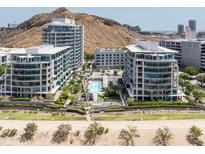 Stunning aerial view of modern condos with a pool and manicured landscaping at 140 E Rio Salado Pkwy # 512, Tempe, AZ 85281