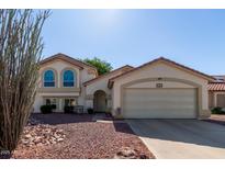 Charming single-Gathering home boasting stucco siding, tile roof, and a well-maintained front yard at 150 N Nielson St, Gilbert, AZ 85234