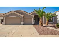 Charming single-story home featuring a spacious three-car garage and desert landscaping at 2945 E Clifton Ave, Gilbert, AZ 85295