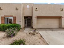 Charming home featuring an attached two-car garage and low maintenance desert landscaping at 1650 S Crismon Rd # 13, Mesa, AZ 85209