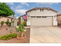 Charming single-Gathering home featuring a two-car garage and a beautifully landscaped front yard at 26145 W Runion Dr, Buckeye, AZ 85396