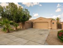 Charming single-story home featuring a well-manicured front yard, spacious driveway, and a two-car garage at 3047 S Chatsworth --, Mesa, AZ 85212