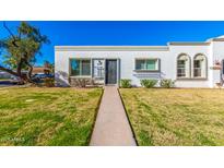 Charming single-story home with well-maintained lawn and walkway at 5047 N 83Rd St, Scottsdale, AZ 85250