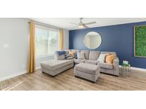 Open-concept living room with a comfortable sofa and great natural light at 5047 N 83Rd St, Scottsdale, AZ 85250