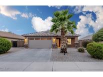 Charming single-story home with a well-maintained front yard and a two-car garage at 6920 S 46Th Dr, Laveen, AZ 85339