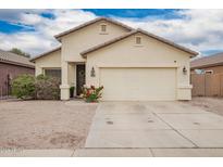 Charming single-story home with a two-car garage and a well-maintained front yard at 1170 E Jardin Dr, Casa Grande, AZ 85122