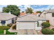 Charming single-story home features a well-maintained yard, a two-car garage, and a neutral color palette at 15815 N 4Th Dr, Phoenix, AZ 85023