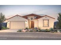 Charming single-story home featuring a tile roof, desert landscaping, and a welcoming arched entryway at 17625 W Rancho Dr, Litchfield Park, AZ 85340
