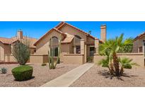 Charming single-story home with desert landscaping, a tiled roof, and a welcoming walkway to the front door at 1910 E Citation Ln, Tempe, AZ 85284