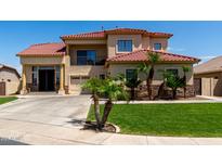 Stunning two-story home with tile roof, lush landscaping, and an attached two-car garage at 3644 E Del Rio St, Gilbert, AZ 85295
