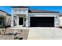 Charming single-story home featuring a modern, neutral color palette and a two-car garage at 5084 E Umber Rd, San Tan Valley, AZ 85143
