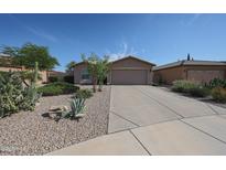 Charming single-story home with desert landscaping and a two-car garage, perfect for comfortable living at 10371 W Pontiac Dr, Peoria, AZ 85382