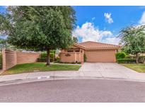 Charming single-story home with a well-manicured lawn, mature trees, and a two-car garage in a desirable neighborhood at 12686 N 95Th Way, Scottsdale, AZ 85260