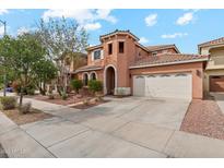 Charming two-story home with a neutral color scheme, three-car garage, and well-maintained landscaping at 14744 W Poinsettia Dr, Surprise, AZ 85379