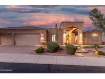 Attractive single-story home with a neutral palette, barrel tile roof, and manicured desert landscaping at 14841 S 6Th Pl, Phoenix, AZ 85048