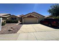 Charming single-story home with a spacious two-car garage and a well-maintained front yard at 4017 W Irma Ln, Glendale, AZ 85308