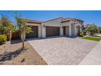 Beautiful single-Gathering home with a well-manicured lawn, a three car garage and a tile roof at 4467 S 116Th Ln, Avondale, AZ 85323