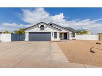 Charming single-story home with a two-car garage, gravel landscaping, and a well-maintained front yard at 10358 N 78Th Ave, Peoria, AZ 85345