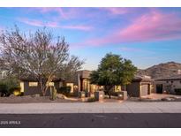 Beautiful single-story home with desert landscaping and mountain views at sunset at 15135 E Sundown Dr, Fountain Hills, AZ 85268