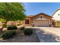 Charming home featuring a manicured lawn, desert landscaping, and a two-car garage at 2140 S Benton Cir, Mesa, AZ 85209