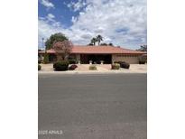 Charming single-story home with a tile roof, desert landscaping, and a welcoming entrance at 2232 E Inglewood St, Mesa, AZ 85213