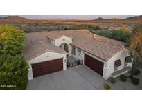 Stunning desert home with a tile roof, two garages, and beautiful landscaping at 31703 N 15Th Dr, Phoenix, AZ 85085