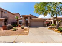 Charming single-story home with desert landscaping and a two-car garage at 3207 E Behrend Dr, Phoenix, AZ 85050