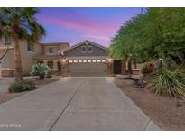 Charming two-story home with a spacious driveway and desert landscaping at 35624 N Zachary Rd, San Tan Valley, AZ 85144