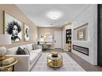Bright living room features a sleek fireplace, modern decor, and sophisticated furnishings at 1367 S Country Club Dr # 1320, Mesa, AZ 85210
