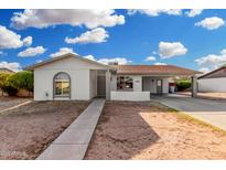 Charming single-story home featuring a covered carport and low-maintenance landscaping at 17616 N 20Th Dr, Phoenix, AZ 85023