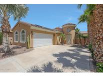 Charming single-Gathering home with desert landscaping, concrete driveway, and an attached two-car garage at 30248 W Earll Dr, Buckeye, AZ 85396