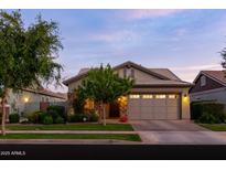 Charming home featuring a well-manicured front yard, stone accents, and a two-car garage at 3437 E Appaloosa Rd, Gilbert, AZ 85296