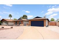 Charming single-story home featuring desert landscaping, brick accents, and a two-car garage at 4528 W Butler Dr, Glendale, AZ 85302
