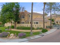 A charming home featuring desert landscaping, a tile roof, and neutral tones in a gated community at 7887 N 16Th St # 226, Phoenix, AZ 85020