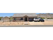 Charming single-story home with desert landscaping, multi-car parking, and mountain views at 8678 S John Jacob Astor Ave, Casa Grande, AZ 85193