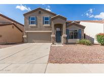 Charming two-story home featuring blue shutters and a two-car garage at 11132 W Mariposa Dr, Phoenix, AZ 85037