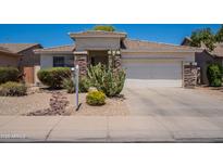 Charming single-story home with desert landscaping, rock accents, and a two-car garage at 170 E Canary Ct, San Tan Valley, AZ 85143