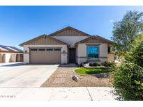 Charming single-story home featuring desert landscaping, a two-car garage, and a welcoming front entrance at 18675 W Foothill Dr, Surprise, AZ 85387