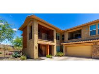 Charming townhome with two stories, stucco, beautiful stone accents, private balconies, and a two car garage at 2425 W Bronco Butte Trl # 2011, Phoenix, AZ 85085