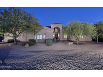 Inviting single-story home boasting neutral stucco, well-manicured landscaping, and a covered front entrance at 39241 N Boulder View Dr, Scottsdale, AZ 85262