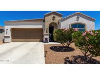 Charming single-story home with a well-maintained yard and covered entryway, plus a two car garage at 4080 W Goldmine Mountain Dr, San Tan Valley, AZ 85144