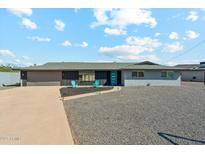Charming home with a well-manicured yard, concrete driveway, and a gray rock garden at 428 E Kachina Trl, Phoenix, AZ 85042
