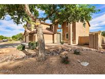Inviting two-story home with a well-manicured front yard, decorative rock, and desert landscaping at 462 W Myrtle Dr, Chandler, AZ 85248