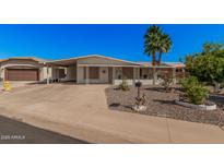 Charming single-story home with desert landscaping and a covered carport in a desirable community at 5808 E Lawndale St, Mesa, AZ 85215