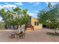 Charming single-story home with well-maintained landscaping, mature trees, and ample parking space at 8209 E 5Th Ave, Mesa, AZ 85208