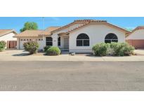 Charming single-story home featuring a well-maintained yard and a classic Southwestern design at 825 E Michigan Ave, Phoenix, AZ 85022