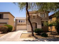Charming two-story home featuring a well-maintained yard and a welcoming entrance at 8516 N 64Th Ave, Glendale, AZ 85302