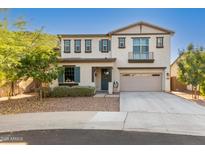 Two-story home featuring a charming front yard and an attached two-car garage at 98 N Bay Dr, Gilbert, AZ 85233